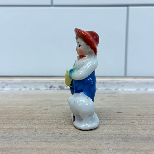 Boy with Pig Figurine, Porcelain