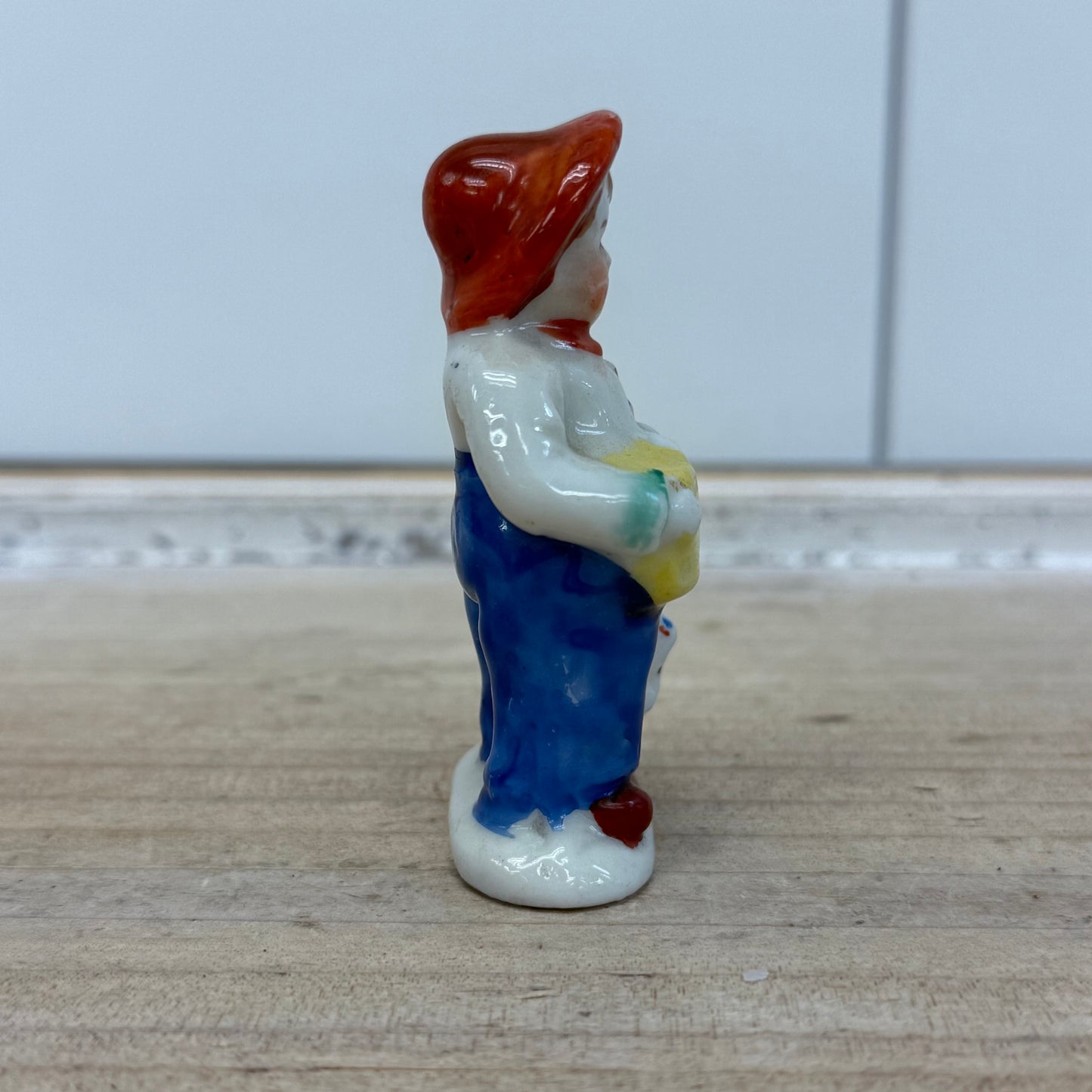 Boy with Pig Figurine, Porcelain