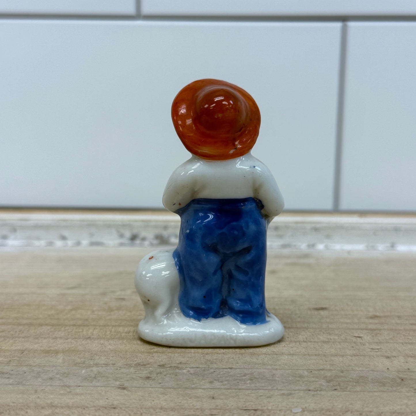 Boy with Pig Figurine, Porcelain