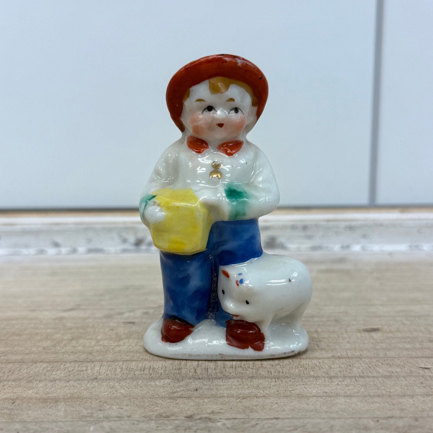 Boy with Pig Figurine, Porcelain