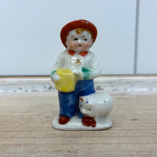 Boy with Pig Figurine, Porcelain