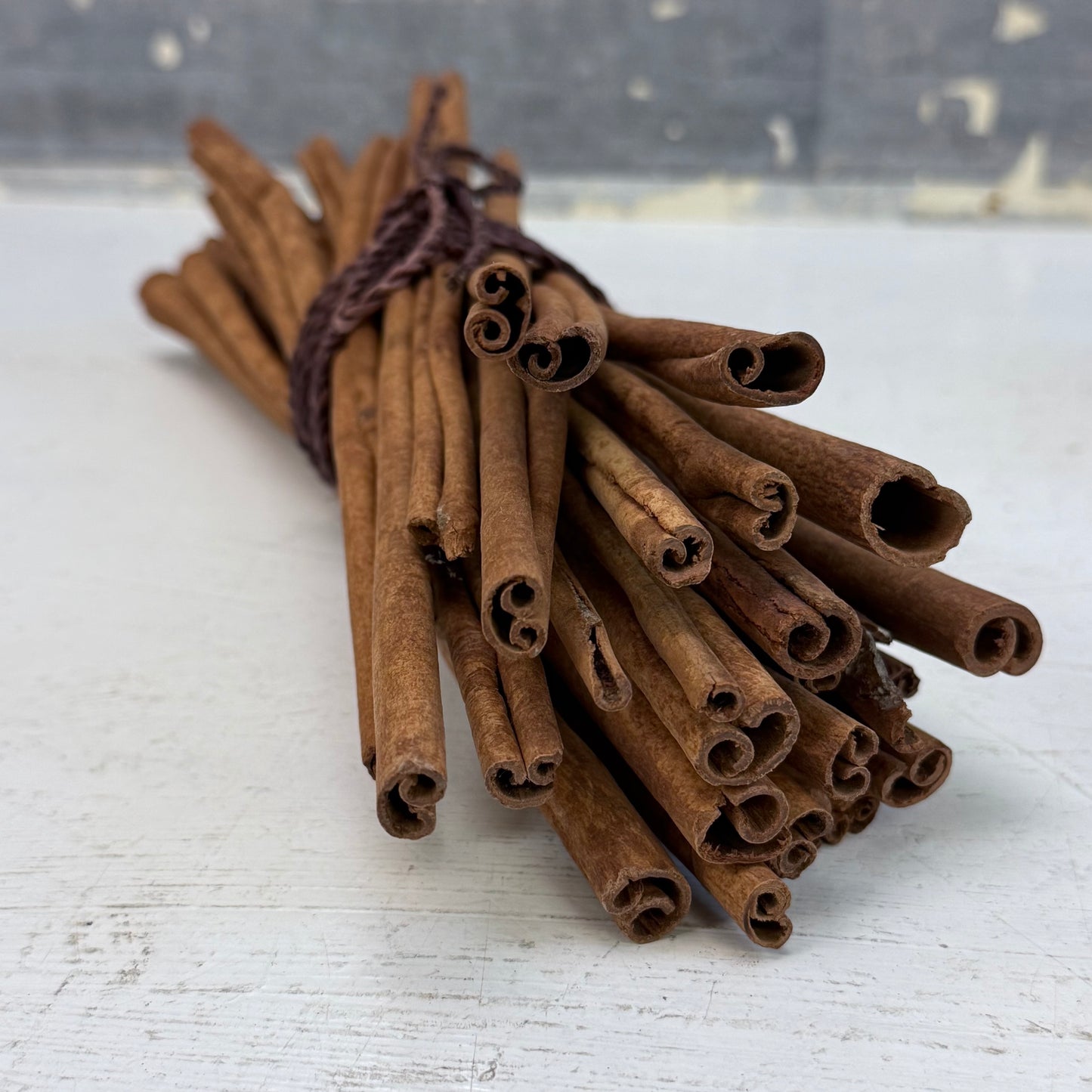 Cast Metal Embossed Basket with Cinnamon Stick Bundle