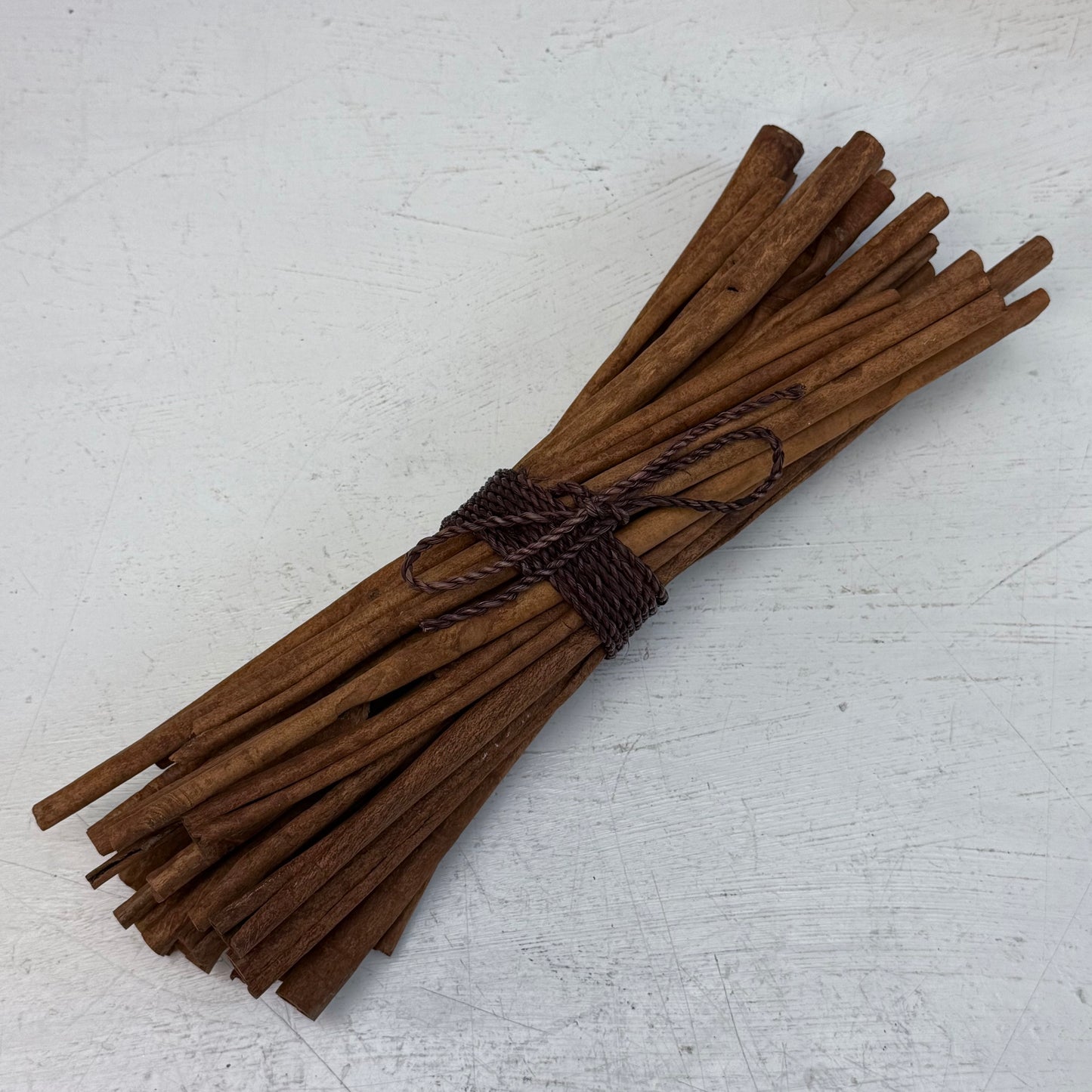 Cast Metal Embossed Basket with Cinnamon Stick Bundle