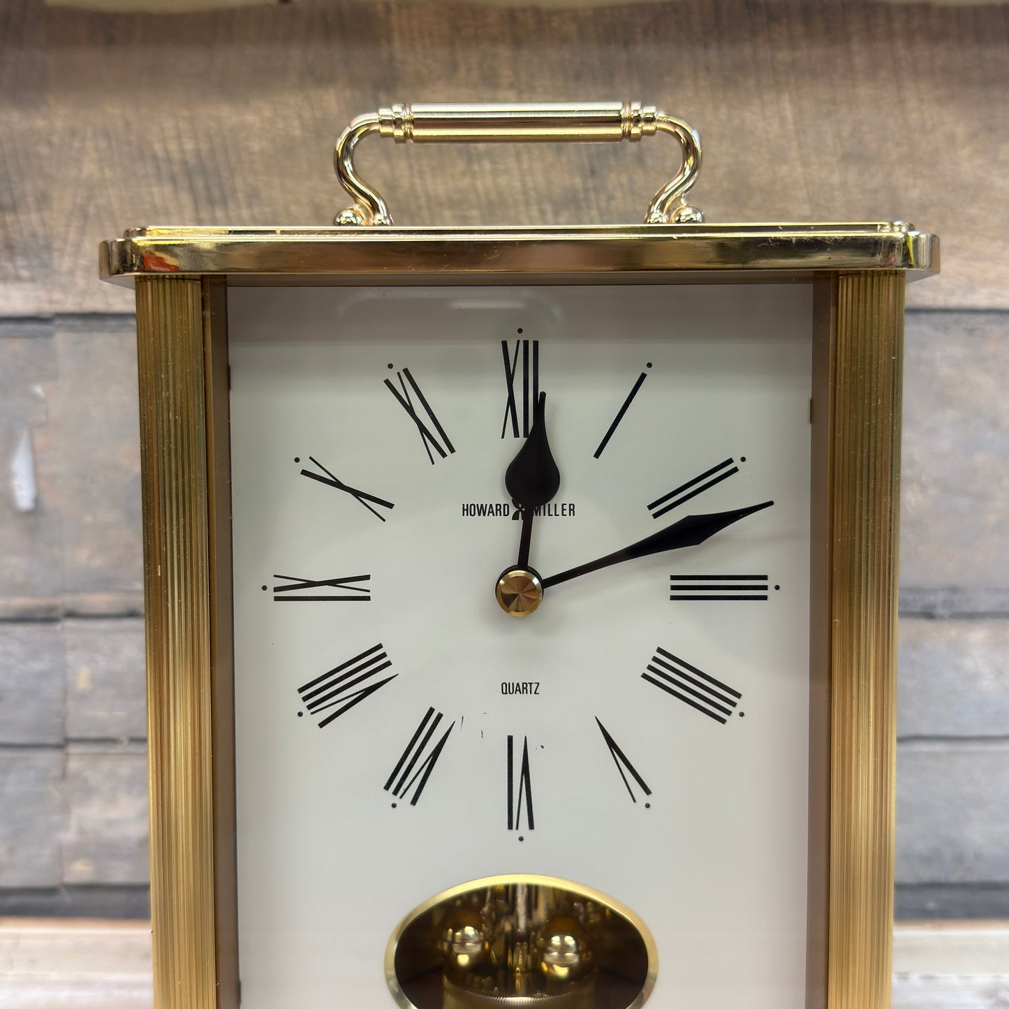 Howard Miller Brass Revolving Pendulum Quartz Table Clock