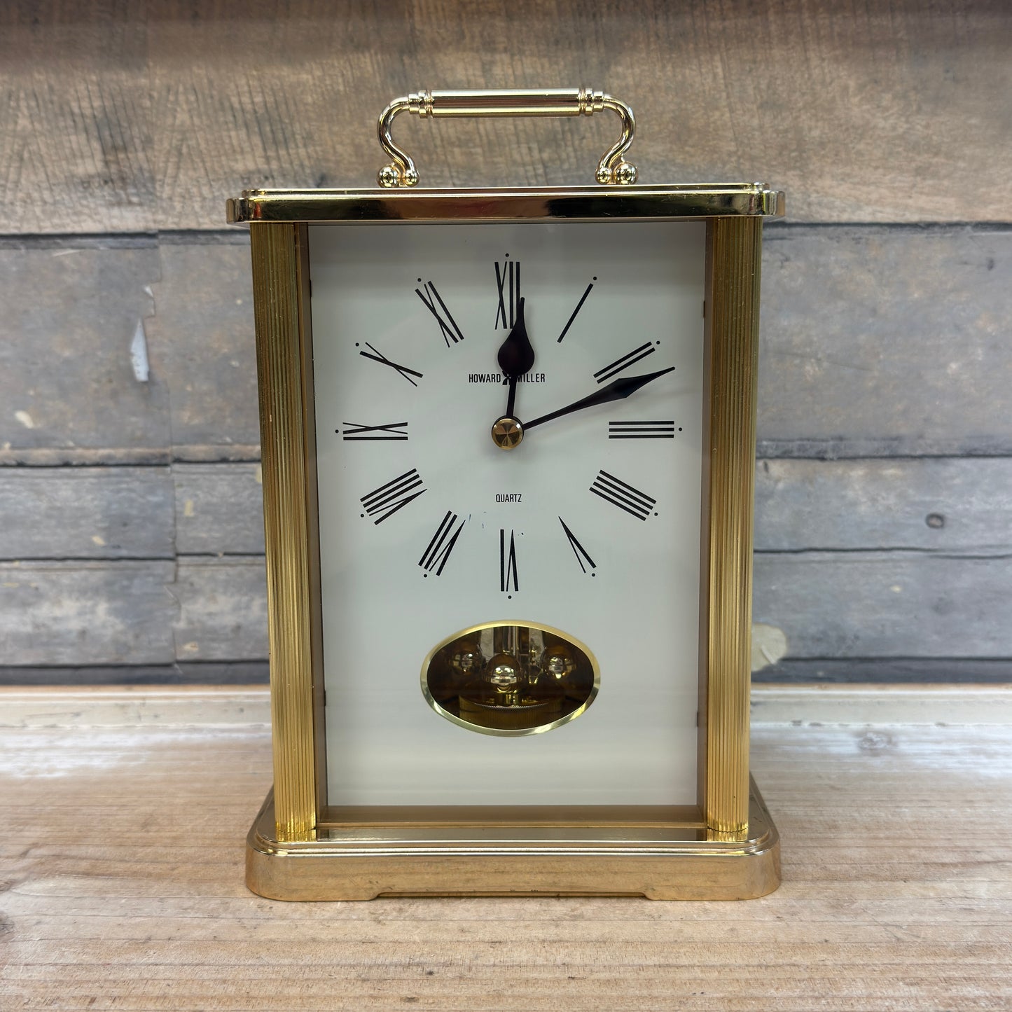 Howard Miller Brass Revolving Pendulum Quartz Table Clock